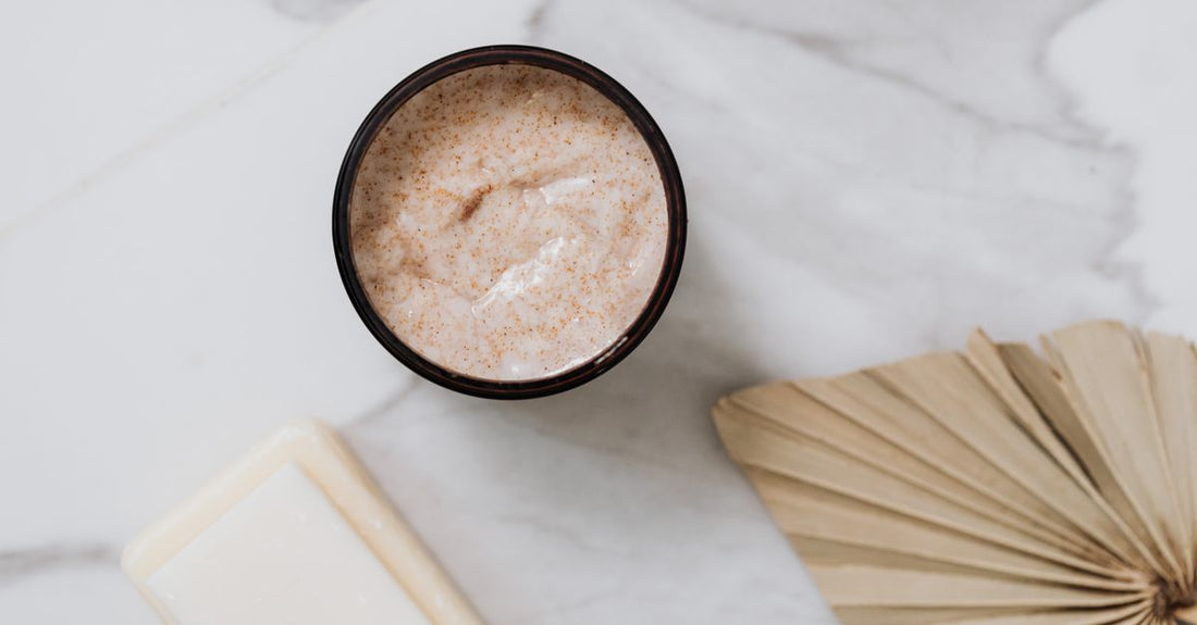 A jar of gentle exfoliating scrub on a clean white surface, demonstrating how to use exfoliating scrub without irritation.