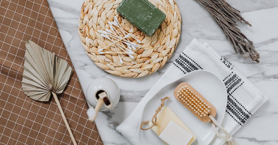 Solid makeup brush cleaner soap and silicone cleaning mat on a marble surface, showing how to choose brush cleaners for hygienic makeup application.
