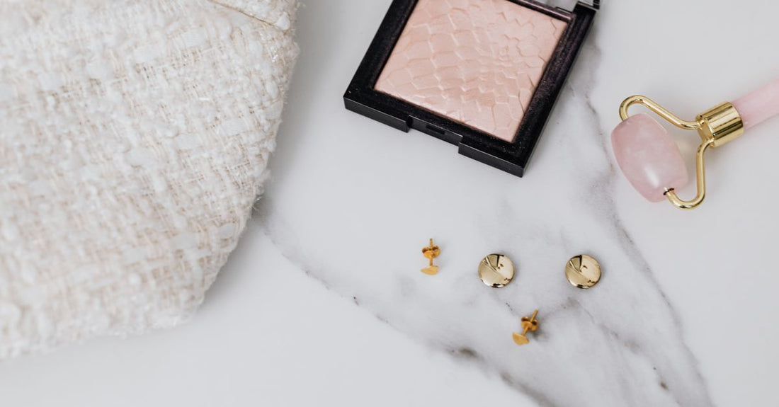A selection of blush compacts on a marble surface, illustrating how to choose blush shades safely.