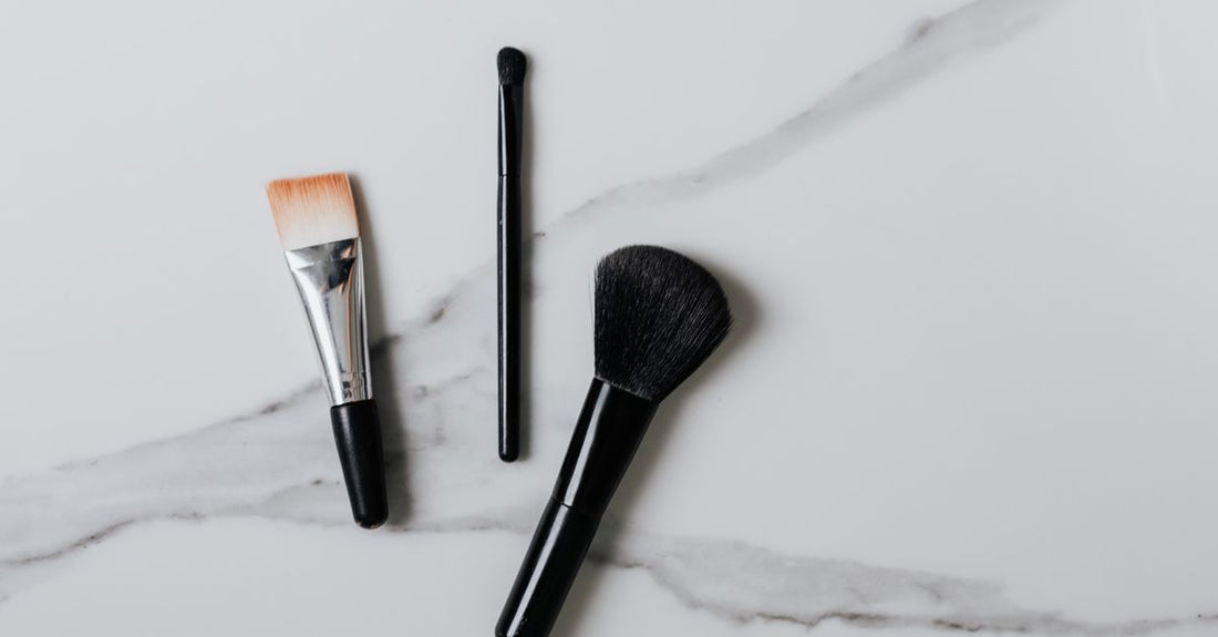 A flatlay of facial kit products on a white marble surface, illustrating how to choose facial kits UK for different skin types.