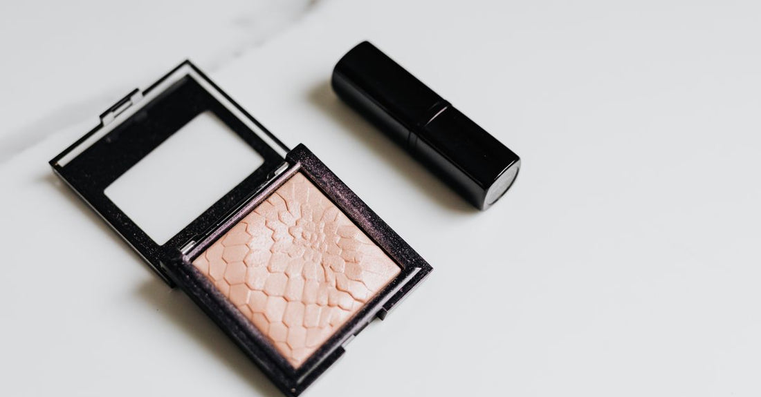 A flat lay of various blush compacts in pink and peach tones, illustrating a blush buying guide for beginners.