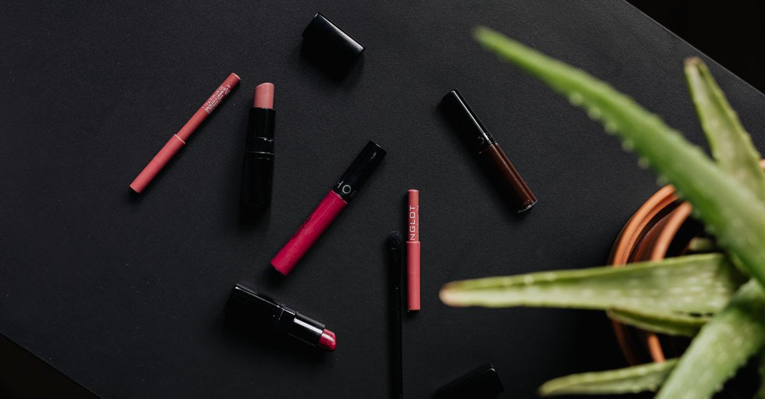 Best lip liner for overlining lips displayed in a flatlay with pencils and swatches
