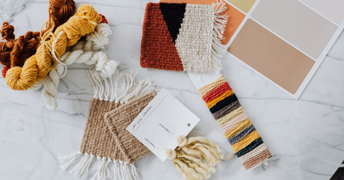 A flatlay of professional hair colour swatches and tubes, illustrating how to choose hair colour correctly.