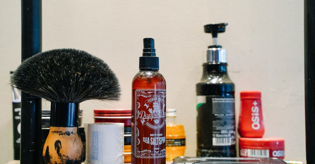 A sleek jar of men's hair pomade on a bathroom shelf, showing how to use hair pomade for men.