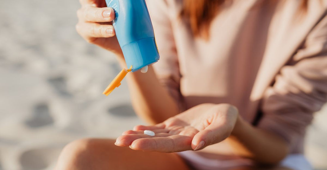 A selection of after sun lotion bottles on a white surface, illustrating an after sun buying guide UK for skincare shoppers.