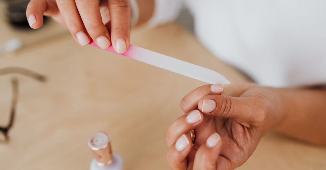 A selection of cuticle removing fluid bottles arranged on a clean white surface, illustrating how to choose cuticle removing fluids
