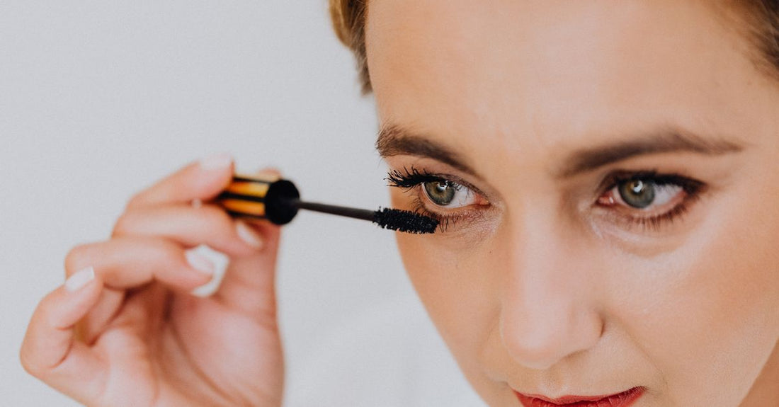 A sleek eyelash curler on a neutral background, illustrating an eyelash curlers buying guide by Avelisse.