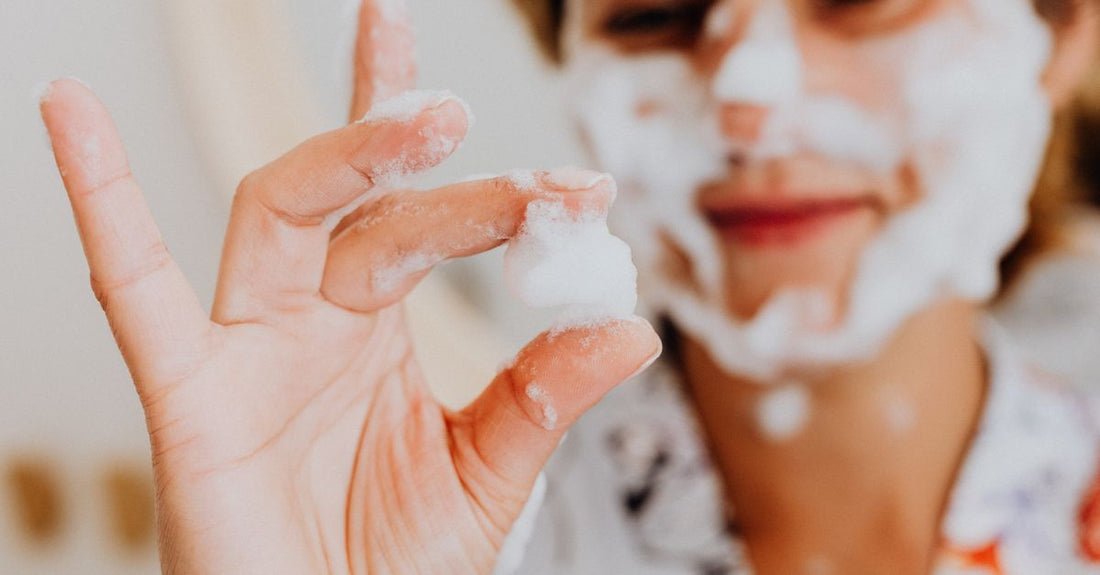 A sleek white foam cleanser bottle against a clean background, illustrating how to choose foams UK for different skin types.