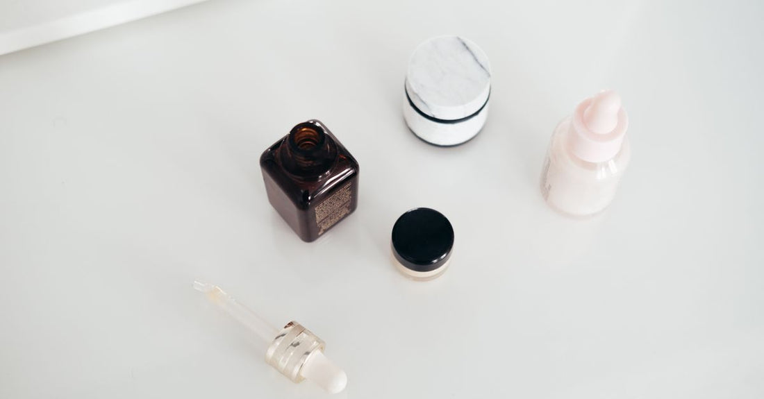 A sleek bottle of the best tinted moisturizer UK 2026 resting on a marble surface, reflecting natural light.