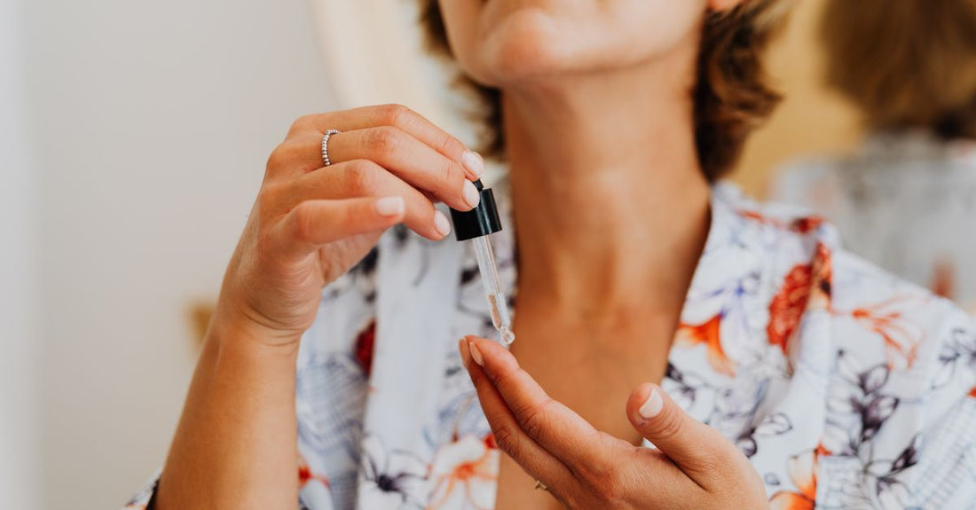 Flatlay of minimalist skincare kit bottles and jars on a clean surface, illustrating a facial kits buying guide for value-conscious UK shoppers.