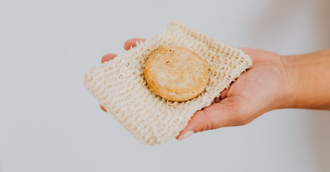 A flatlay of natural and mesh loofahs for the best loofahs 2026 guide, with neutral background.