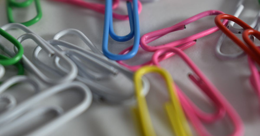 An assortment of the best clips 2026 laid flat on a white surface, including alligator, snap, and duckbill styles.