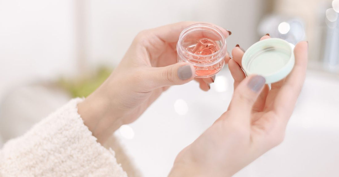 A jar of lightweight moisturising cream on a marble surface, representing the best creams 2026 for summer hydration.