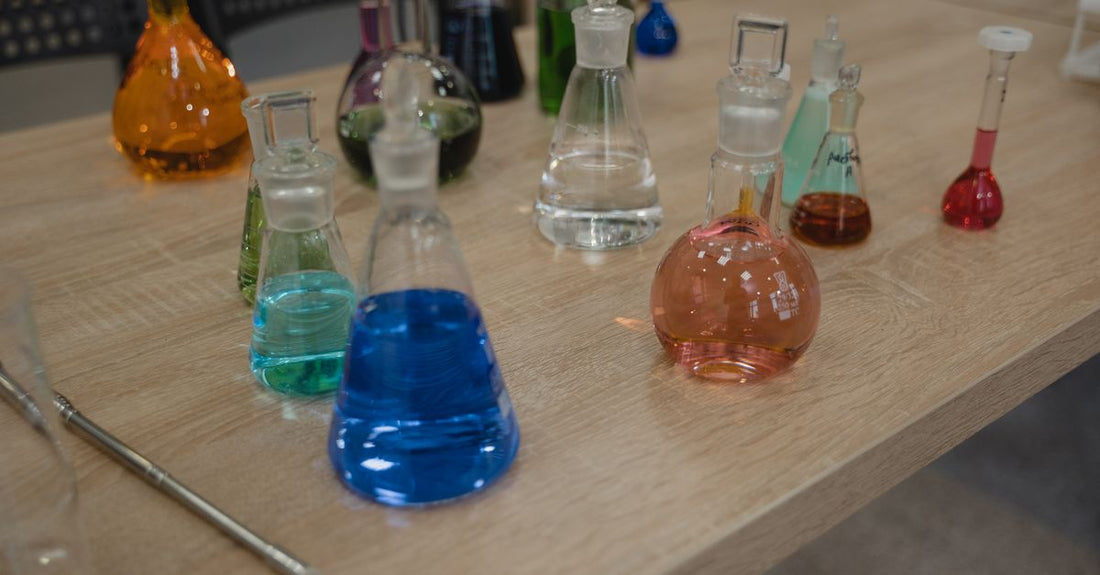 A selection of science-backed body wash bottles on a clean laboratory shelf, representing the best body washes 2026.