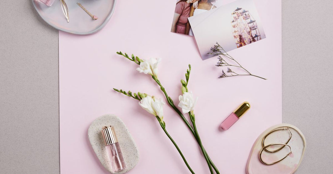 Skincare gift set flatlay with bottles and jars on marble surface, sets & kits buying guide UK