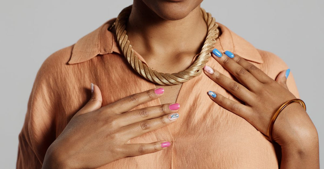 Five stylish nail polish bottles in trending 2026 shades arranged on a clean white surface, representing the best nail polish 2026 selection.