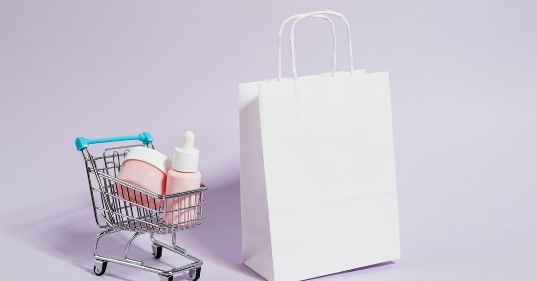 A flatlay of durable cosmetic bags in various materials including clear PVC, canvas, and leather, illustrating the best cosmetic bags 2026 for long-lasting use.
