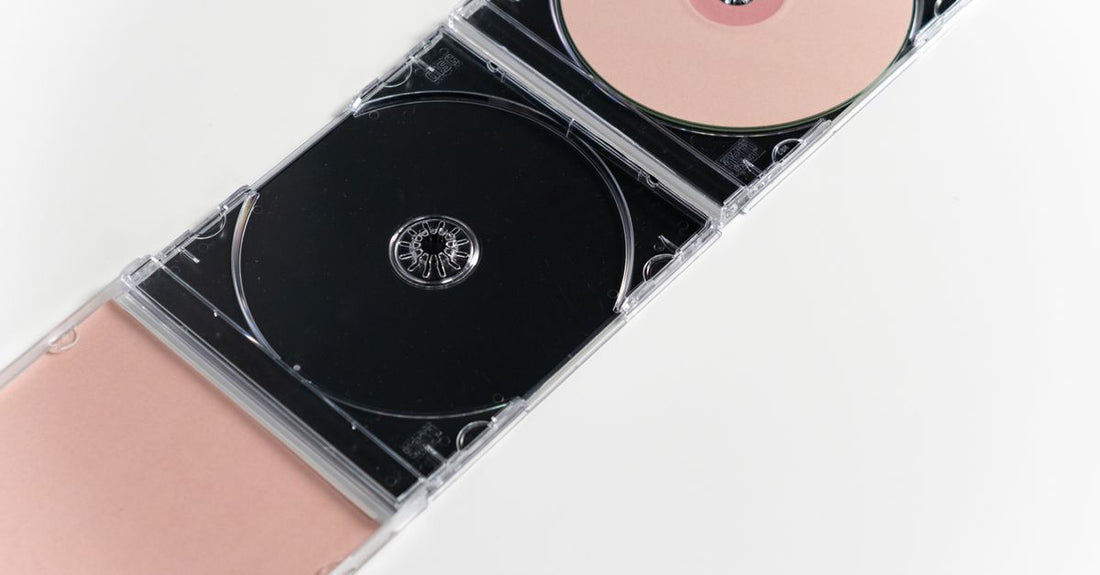 A curated flatlay of classical music CDs including the best classical 2026 picks on a minimalist desk, representing a structured listening routine.