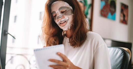 A selection of face mask jars and tubes on a marble surface, showcasing where to buy masks online for long-term skin results.