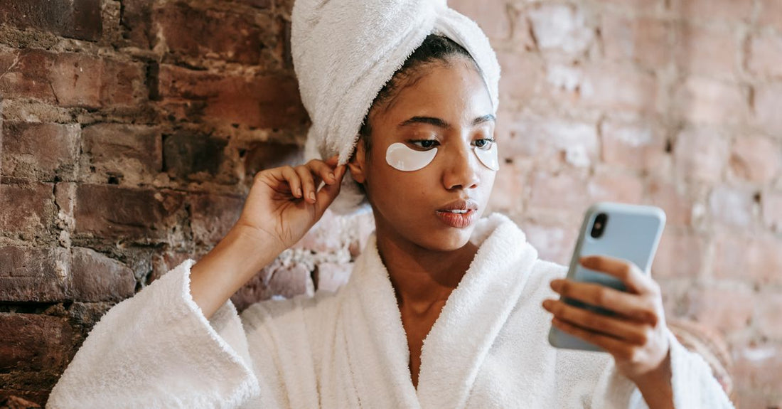 Soft terry cloth spa headband for skincare routine lying on a white towel, how to use headband for skincare routine