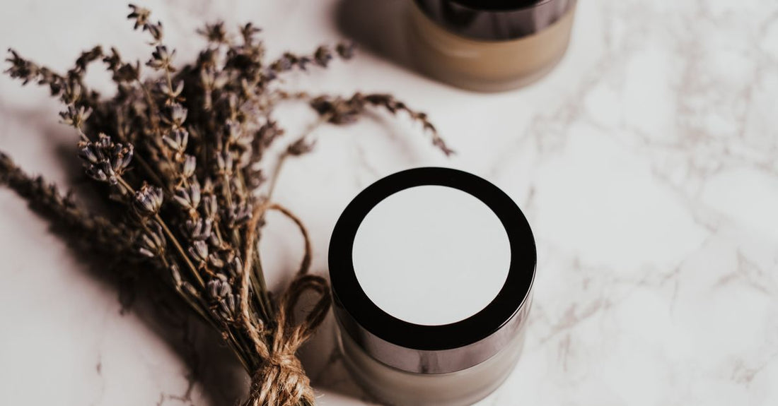 A sleek conditioner bottle on a marble surface, illustrating how to choose conditioners for UK hair types.
