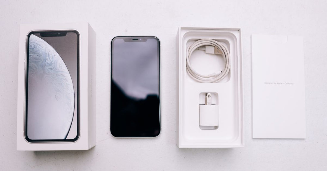 A flatlay of various replacement shaver charger cables and adapters on a neutral background, illustrating an accessories buying guide for UK beauty shoppers.