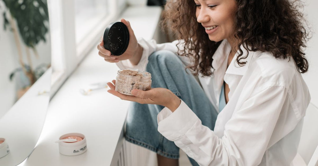Eau de parfum buying guide featuring a collection of perfume bottles on a white marble surface, showcasing different price tiers.