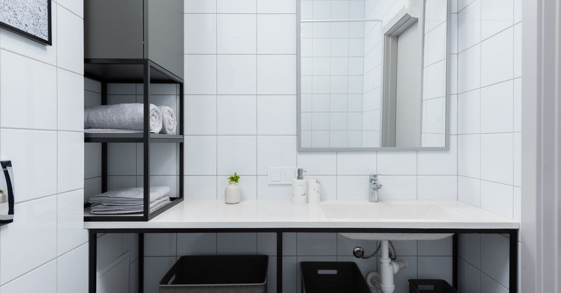 A selection of body wash bottles lined up on a bathroom shelf, illustrating how to choose body washes for different skin needs.