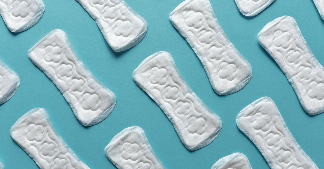 A stack of soft cotton towelettes and textured cleansing cloths on a light surface, illustrating how to choose cloths & towelettes UK for different skin needs.