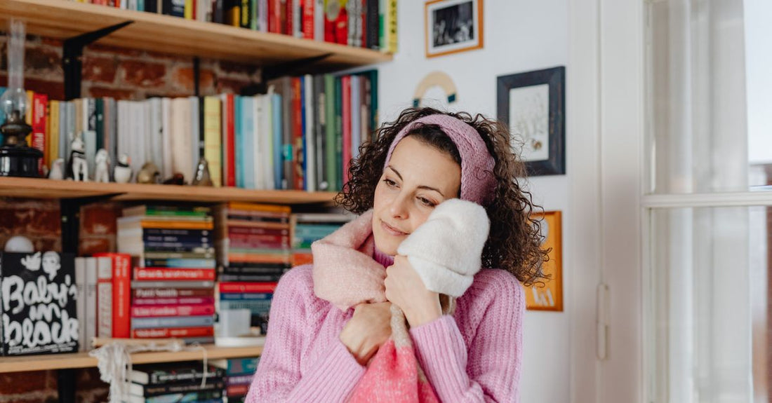 A flatlay of assorted pastel-coloured fabric headbands on a white background, illustrating a headbands buying guide UK.