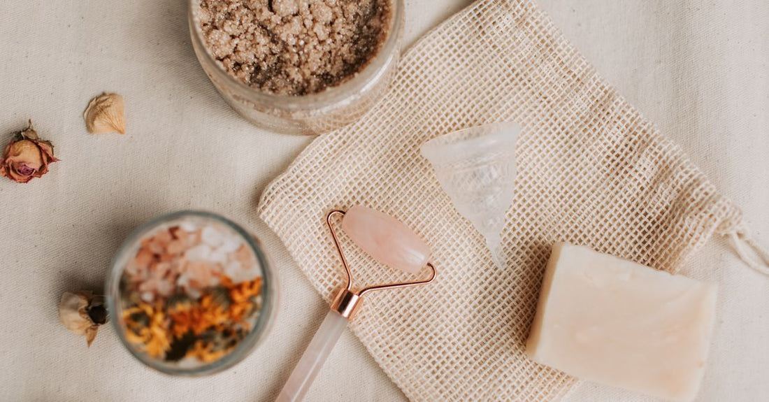 A flatlay of soothing skincare products for eczema, psoriasis and rosacea care UK including creams and balms on a neutral background.