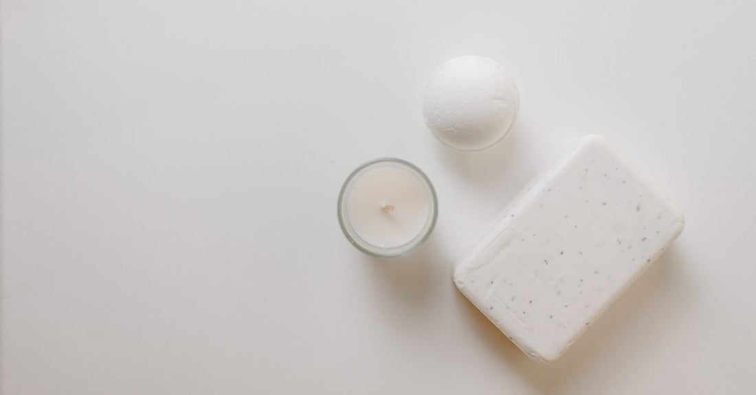 A selection of colourful handmade bath bombs arranged on a marble surface, illustrating how to choose bath bombs for a luxurious soak.