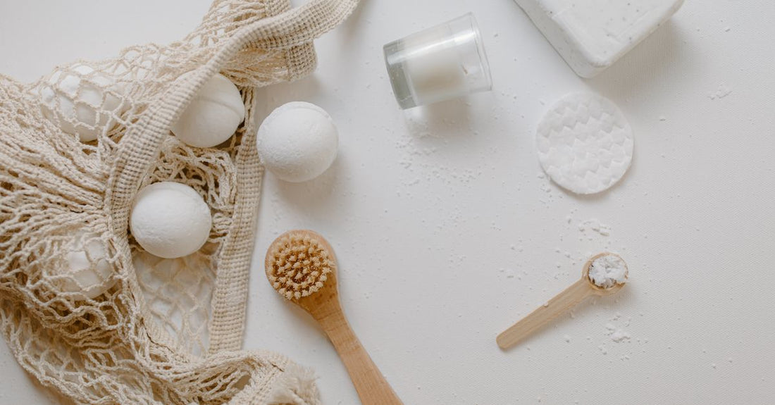 A colourful assortment of handmade bath bombs arranged on a white surface, illustrating how to choose bath bombs based on appearance and ingredients.