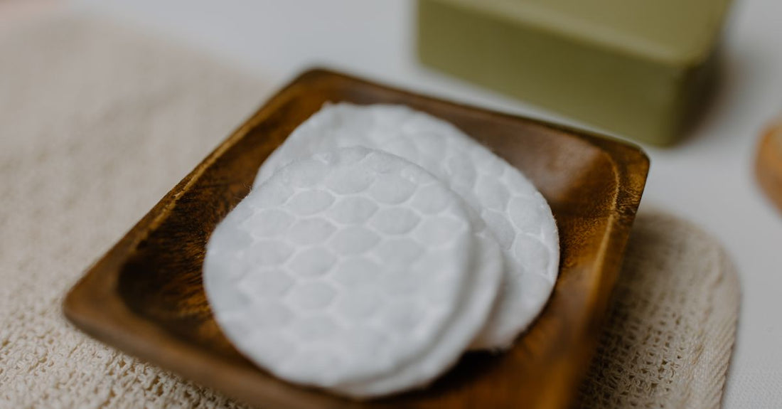Stack of white cotton pads and rounds on a bathroom shelf, best cotton pads & rounds UK 2026