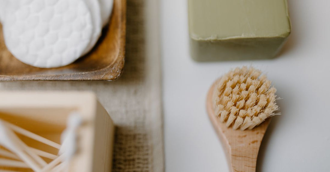 A selection of best cloths & towelettes 2026 arranged on a light marble surface, including microfibre, sisal, and cotton options, with a minimalist aesthetic.