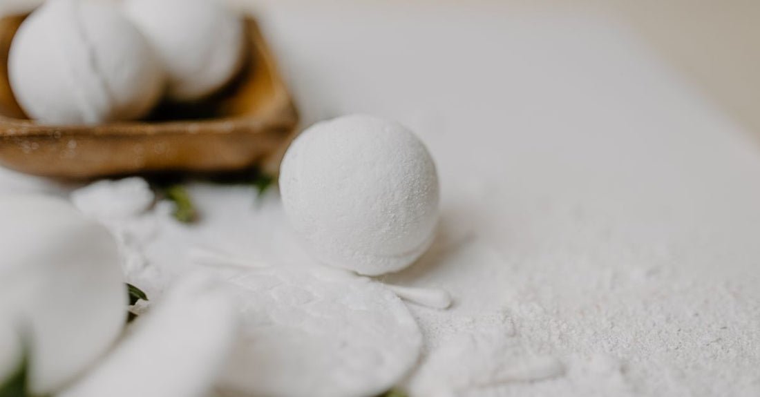A selection of vibrant handmade bath bombs on a marble surface, showcasing the best bath bombs 2026 for a luxurious soak.