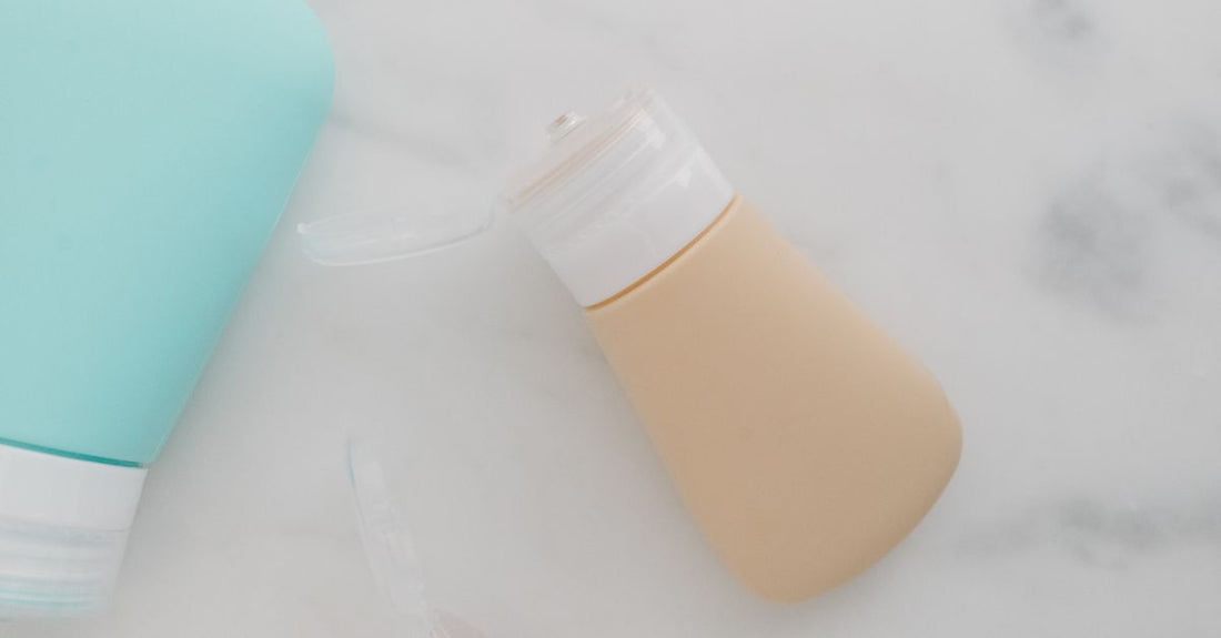 Selection of hair care products including shampoo, conditioner, and treatment bottles on a light background - how to choose hair care UK guide