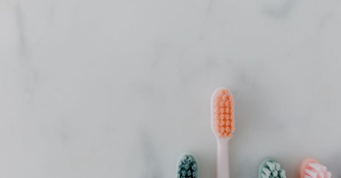 Assorted hair brushes displayed on a flat white surface, illustrating a hair brushes buying guide UK