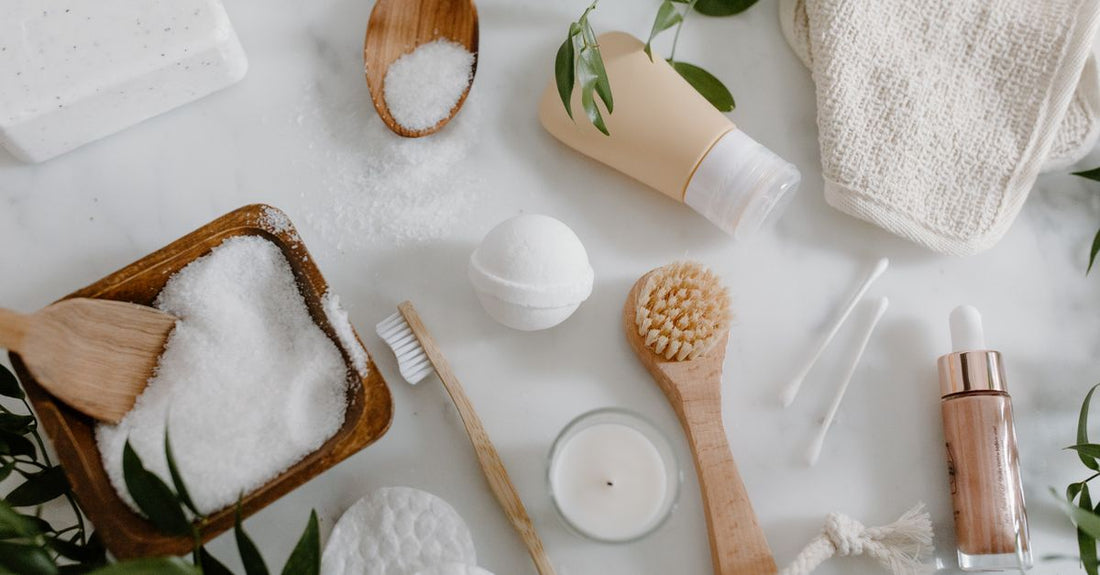 A curated selection of the best kits UK 2026 skincare products arranged on a marble surface with a notebook and pen.