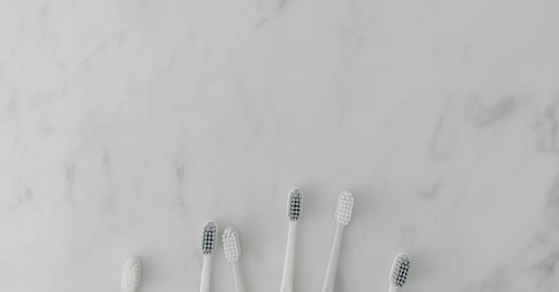 Best hair brush for detangling wet hair displayed on a clean surface with water droplets.