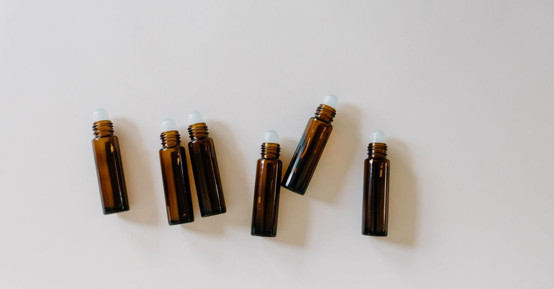 A flatlay of various hair rollers including foam, velcro, and heated types on a white background, demonstrating how to choose hair rollers for different hair needs.