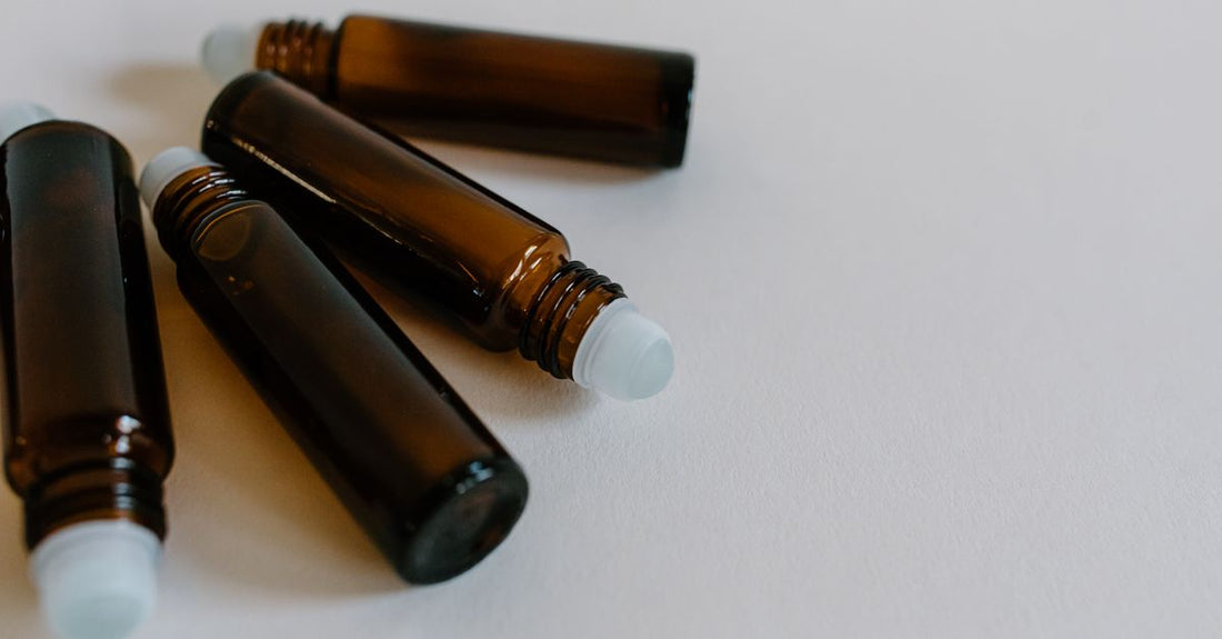 Medicube spot care and drying lotion bottles on a marble surface, comparing spot treatment options.