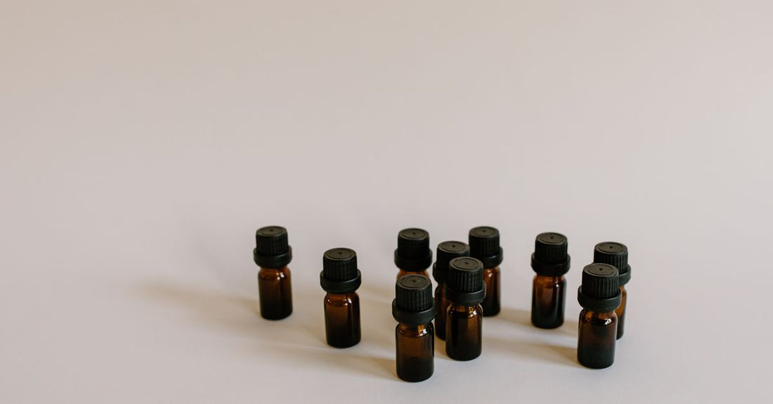 An arrangement of cuticle oil bottles and pens on a white background, illustrating a cuticle oils buying guide