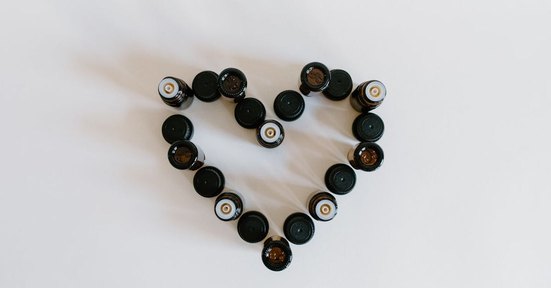 A selection of face oil bottles with droppers on a light marble surface, illustrating how to choose oils UK shoppers will love.