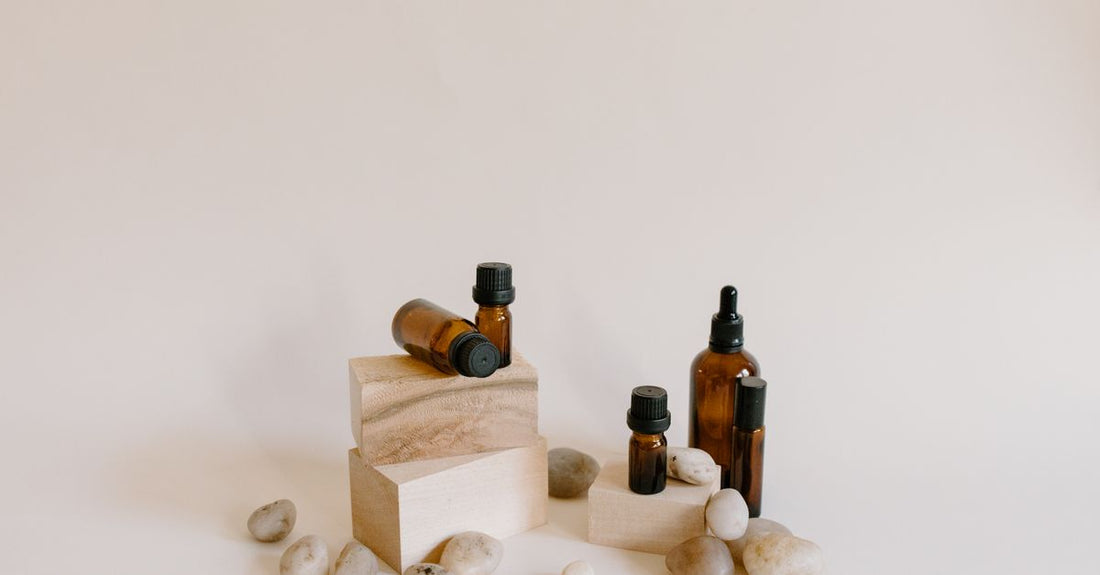 A selection of chemical hair straightener product bottles on a shelf, illustrating how to choose chemical hair straighteners for different hair types.