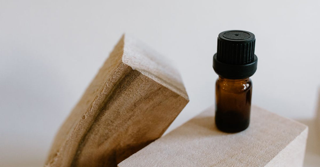A selection of the best beard oils 2026 on a wooden surface, showcasing natural ingredients and sleek packaging.
