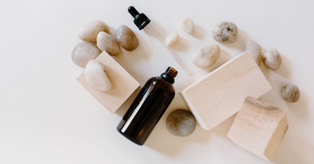 A selection of beard conditioners and oils arranged on a dark slate surface, representing a beard conditioners & oils buying guide for UK shoppers.