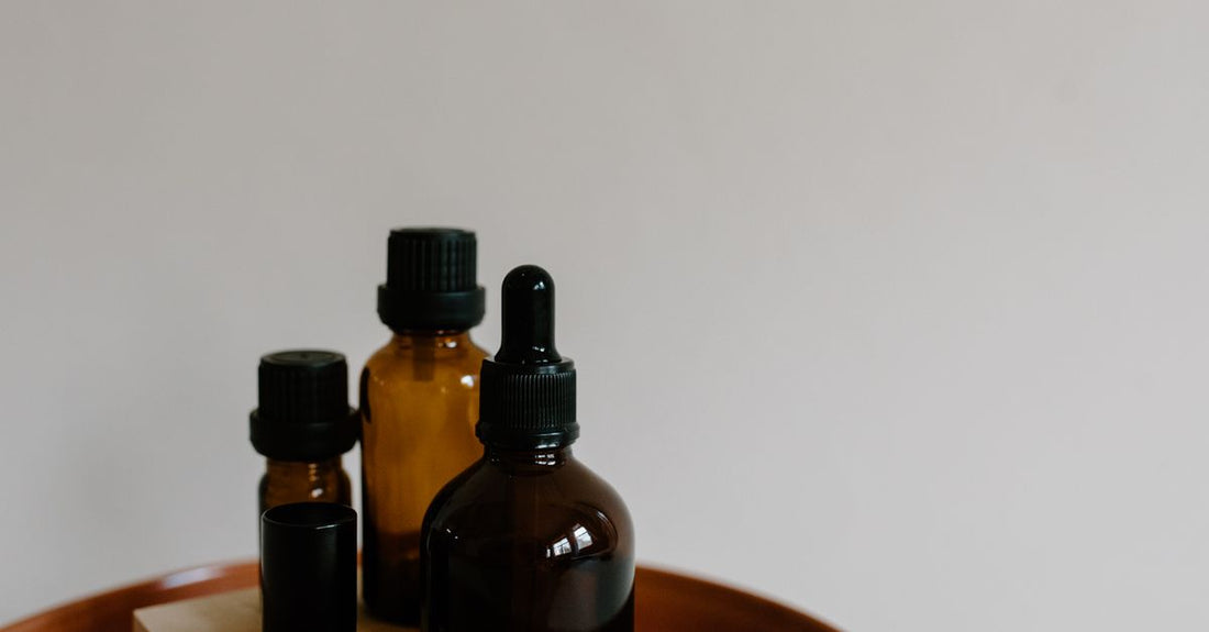 A selection of the best bath oils 2026 displayed on a marble surface, showcasing budget, mid-range, and luxury options available in the UK.