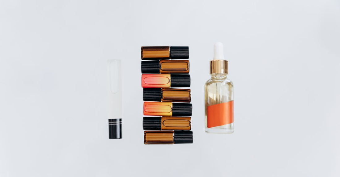 Assorted cologne bottles on a shelf, illustrating how to choose cologne by comparing different scent profiles and bottle designs.
