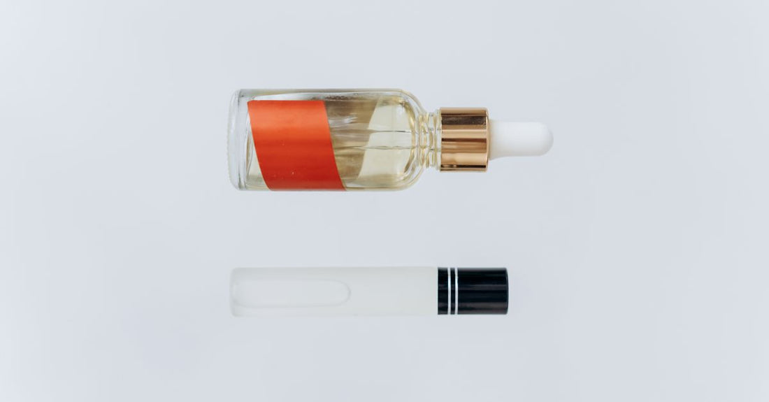 Best face UK 2026 skincare products arranged on a marble surface with a serum bottle and moisturiser jar
